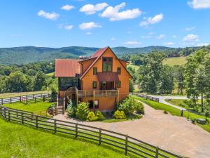 a house on a hill with a fence at Mio Nido at Eagles Nest in Newland