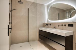 a bathroom with a sink and a mirror at Hoeve de Eik in Epen +29 photos