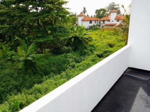 a view from the balcony of a house at Tropical Suites - Airport Transit Residence in Negombo