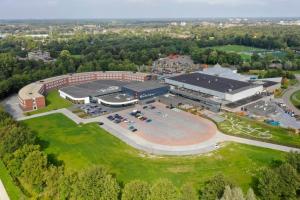 an aerial view of a building with a parking lot at Hotel De Bonte Wever Assen in Assen
