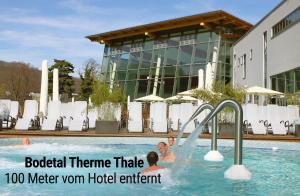 a group of people playing in a swimming pool at H24 Parkhotel Thale in Thale