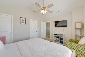 a white bedroom with a bed and a ceiling fan at Great for Groups! 2 Centrally Located Concord Gems in Concord