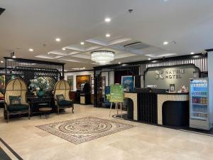 a large room with chairs and a counter in a store at Nature Hotel and Spa Ha Noi in Hanoi +95 photos