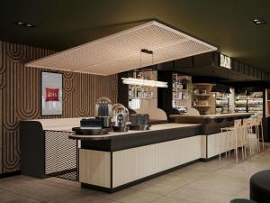 a kitchen with a counter and a counter top at ibis Konstanz in Konstanz
