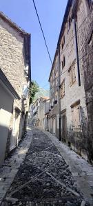 an old cobblestone street in an old building at Palazzo Gabela in Risan