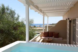 a view of the ocean from the patio of a house at Domotel Kea in Koundouros