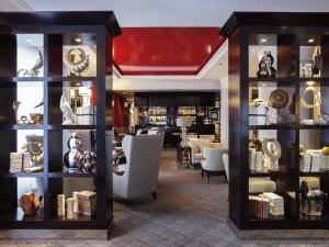 a room with a store with a lot of items on shelves at Park Hotel Grenoble - Handwritten Collection in Grenoble