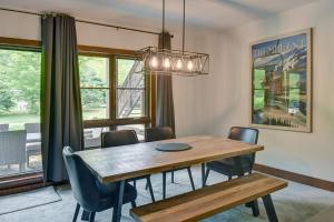 a dining room with a wooden table and chairs at Tremblant Prestige - Étoile 1510-23 in Mont-Tremblant +17 photos