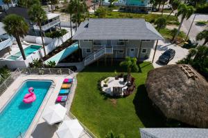 an aerial view of a house with a swimming pool at The Dex at Coconut Cove in Fort Myers Beach
