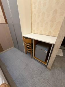 a small room with a table and a chair at Regency Sunset Condotel in Angeles