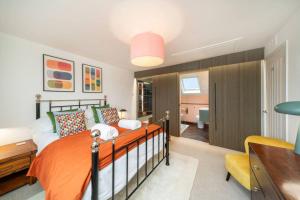 a bedroom with a bed and a desk at Westland Shores - An East Neuk Gem in Crail