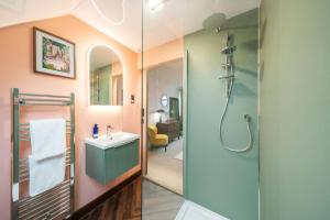 a bathroom with a shower and a sink at Westland Shores - An East Neuk Gem in Crail
