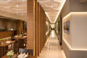 a corridor of a restaurant with tables and chairs at Hotel Gareji Kakheti in Sagarejo +48 photos
