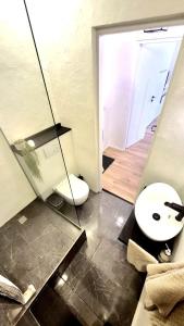 a bathroom with a toilet and a sink at Muna Living in Riga