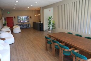 a conference room with a long table and chairs at Karasu Riva Otel in Karasu