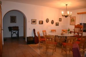a dining room with a table and a table and chairs at Turisticna Kmetija Pudvoi in Bizeljsko