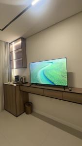 a room with a large flat screen tv on a wall at Dara in Al Khobar