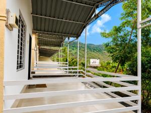 a building with a balcony with a view of the mountains at Royal Villa Resort in Sāngli +53 photos