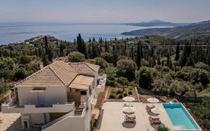 an aerial view of a house with a swimming pool at Askos Suites in Agios Nikolaos