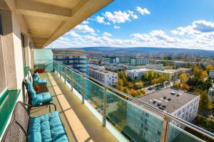 a balcony with a view of a city at Red Hotel Accommodation in Cluj-Napoca