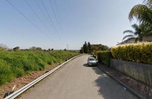 a car parked on the side of a road at רונלדו in Beʼerot Yiẕẖaq
