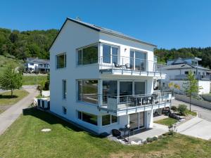an aerial view of a white house at Ferienhaus Aura in Bodman-Ludwigshafen