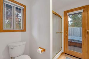 a bathroom with a toilet and a walk in shower at Mt. St. Helens - Unit 9 in Sunriver +39 photos