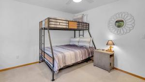 a bedroom with a bunk bed and a mirror at Mt. St. Helens - Unit 9 in Sunriver