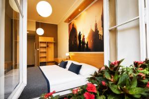 a bedroom with a bed and a window at Hotel Adler - Czech Leading Hotels in Prague