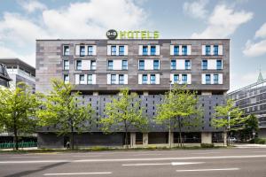 a building with a hotel sign on top of it at B&B Hotel Maribor in Maribor