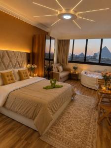 a large bedroom with a large bed and a couch at panorama pyramids and jacuzzi in Giza +54 photos