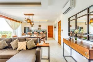 a living room with a couch and a table at Eight Condos Multi Listing in Playa del Carmen
