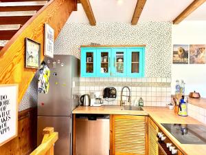 a kitchen with a refrigerator and a sink at House at Jenischpark in Hamburg +24 photos