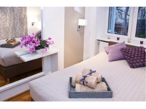 Posteľ alebo postele v izbe v ubytovaní Srebrna Warsaw Apartment