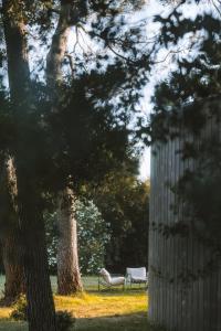 a park with two chairs and a tree at Haras de Castellane in Pertuis +78 photos
