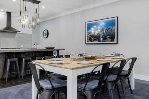 a dining room with a table and some chairs at Edelweiss Cottage in Berridale