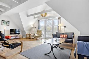 a living room with a couch and a table at 0045-Romo-Thadesvej-13 in Høm