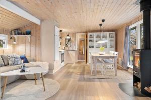 a living room with a couch and a table at 0664-Toftlund-Sydmarken-83 in Toftlund