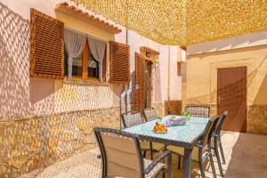 a table and chairs sitting on a patio at Can Pedro Ros in S'Illot