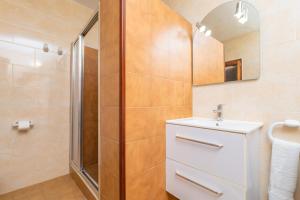 a bathroom with a sink and a shower at Can Pedro Ros in S'Illot +29 photos