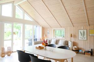 a living room with a white table and chairs at 11866-Nykobing-Sj-Skippervej-17 in Nyrup