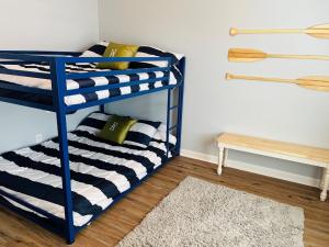 a bunk bed in a room with a rug at 3 4 Time in Holden Beach +33 photos