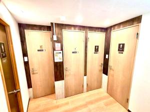 a row of lockers in a room with wood at Rhodes Kagurazaka in Tokyo +8 photos