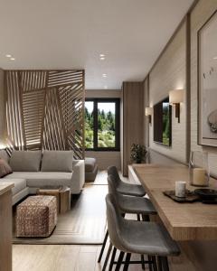 a living room with a couch and a table at West Hill Apart Hotel in Kopaonik