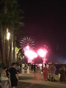 a crowd of people watching fireworks at night at Studio port santa lucia in Saint-Raphaël +43 photos