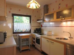 a small kitchen with a sink and a window at Haus Linn in Hachenburg