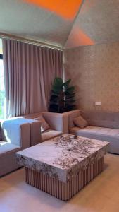 a living room with a couch and a table at Wadi Bani Khalid Oasis in Dawwah +36 photos