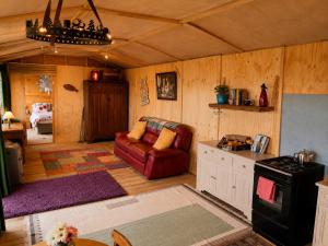 a living room with a couch and a stove at Donegal Oceanview Retreat in Drumaville