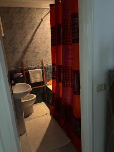 a bathroom with a toilet and a sink at شمس in Hammamet Nord