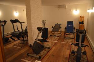 a gym with several exercise equipment in a room at Ermolaos Hillside Villas in Lixouri